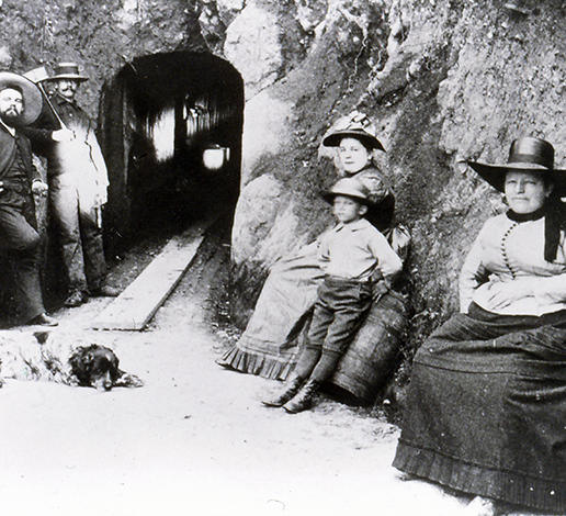 Annie Schram with her son Herman and cellar workers rest at entrance to Schramberg wines caves, circa 1890