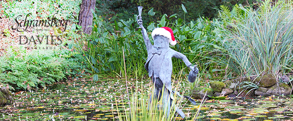 The "Riddler" frog statue on Schramsberg pond wearing a Santa hat.