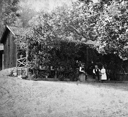 Jacob Schram family members gathered on steps of historic redwood cabin on Schramsberg property, circa 1862